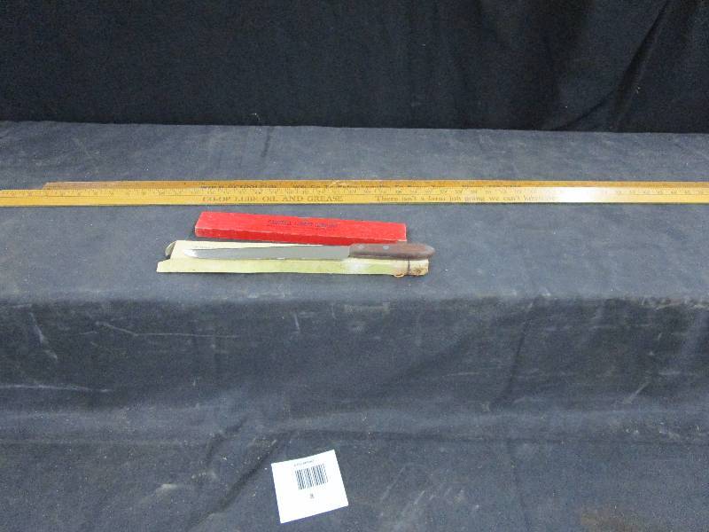 lot 8 image: The Burns Bread Knife, Rulers and level Cambell Lumber Company