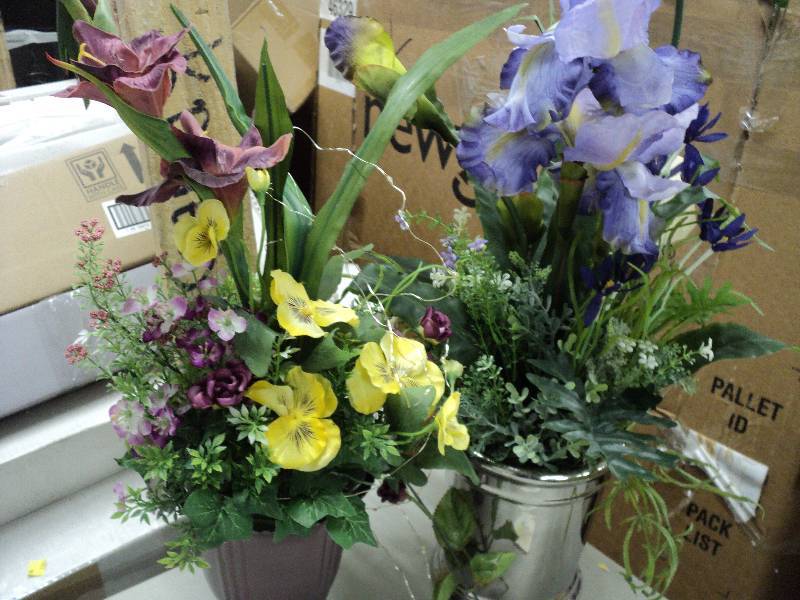 2 floral arrangements in pots...