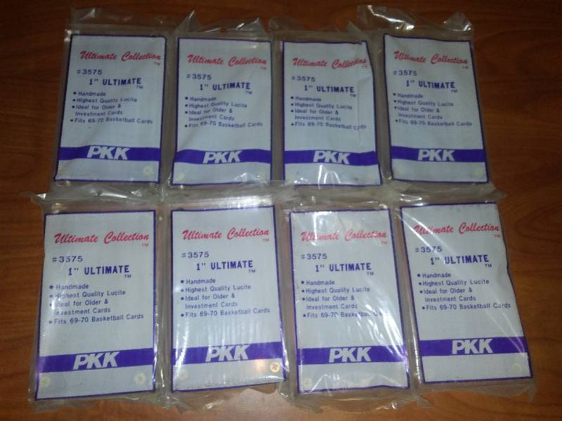 lot 65 image: 8 one-inch Lucite solid cardholders.