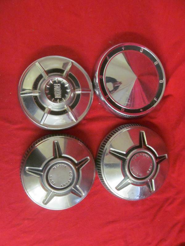 lot 99 image: vintage Ford Hubcaps