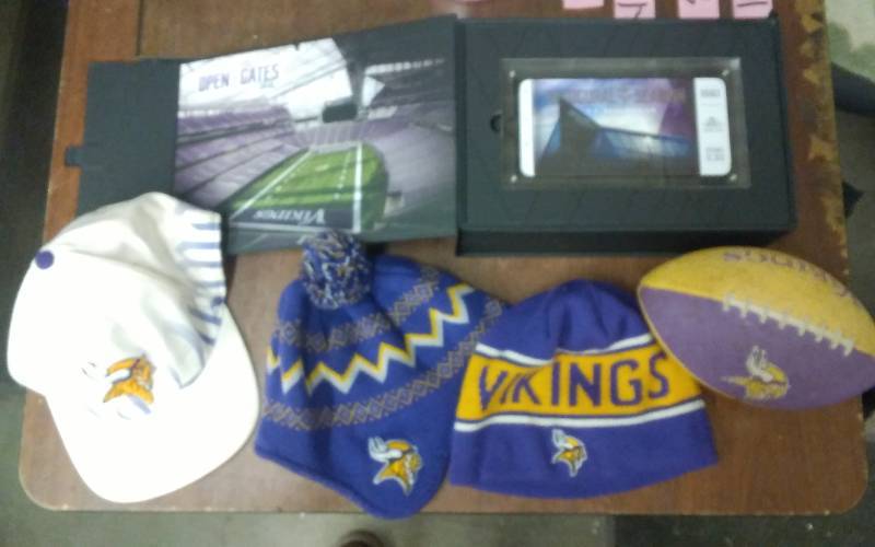 lot 27 image: Collectors 2016 Inaugural Season Game Day Ticket & Vikings App With Cell Phone Battery, 3-Vikings Stocking Hats, 1-Cap