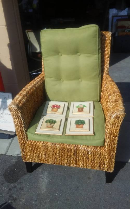 lot 63 image: Pier 1 Wicker Chair With 2 Green Cushions & 4-Garden Pictures