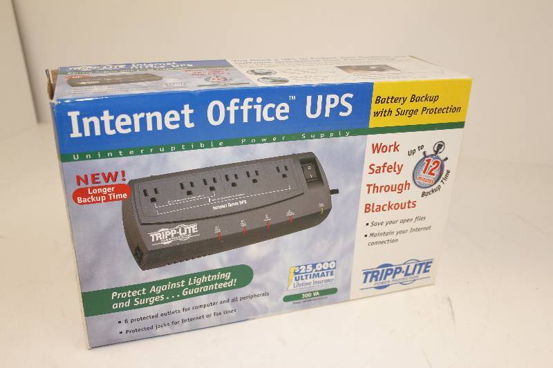 lot 19 image: Tripp Lite power back up system and surge protector top of the line