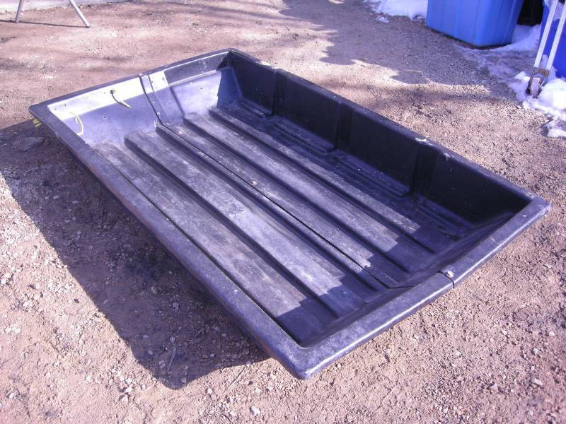 lot 7 image: Black Plastic Pull-behind Sled