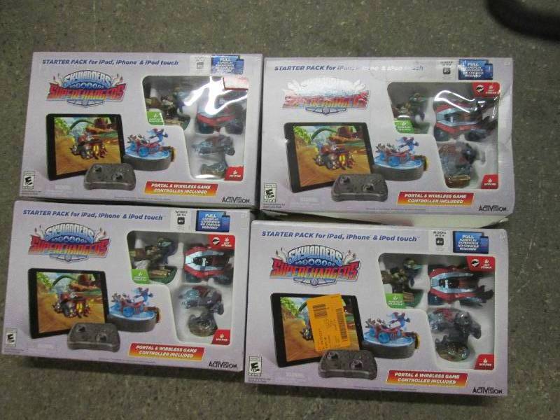 lot 205 image: 4 Skylanders starter packs for iPad...
