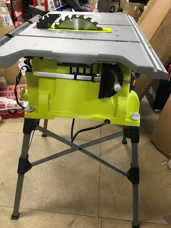 ryobi 10 portable table saw with quick stand in good condition missing misssing guard and the guide