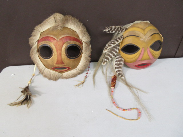 lot 135 image: WOODEN AND FUR TRIMMED MASKS