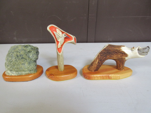 lot 380 image: ANTLER CARVINGS AND A STONE BEAR STATUE