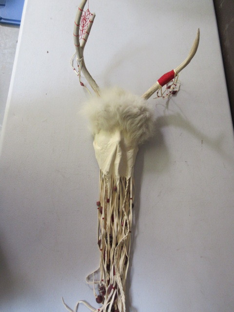 lot 404 image: LEATHER, ANTLER , FUR WALL HANGING BY SAVAGE