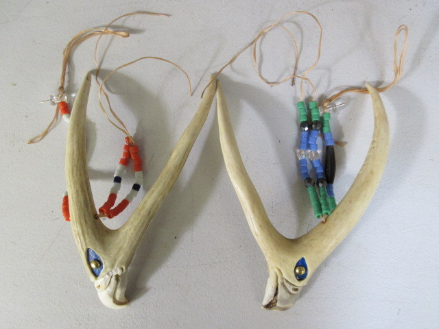 lot 408 image: CARVED AND BEADED DEER ANTLERS