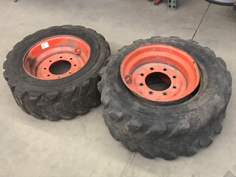 lot 61 image: (2) 1216.5 Skidloader Tires & Rims...