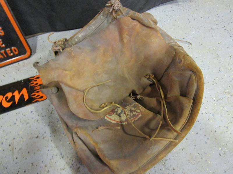 lot 31 image: Vintage Saddle Bags & Tin Harley Signs