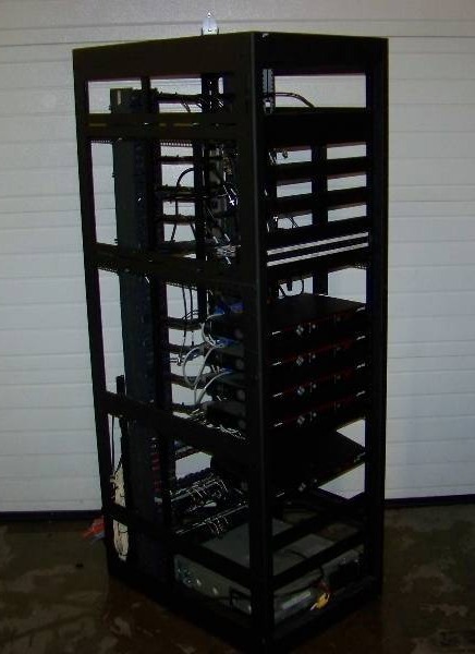 lot 83 image: Large Computer  Server  Audio and Video Equipment Rack with 12 Outlet Power Strip and various Components included
