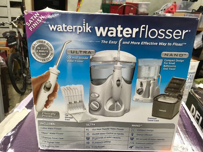 lot 158 image: WATERPIK ULTRATRAVELER, MSRP $79.99