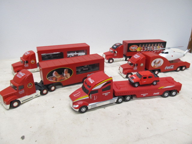 lot 31 image: Lot of Coca Cola Advertising Toy Semi Trucks 