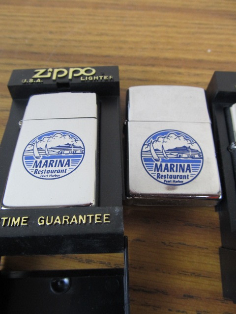 lot 164 image: Group of 3 Hawaii Themed Zippo Lighters