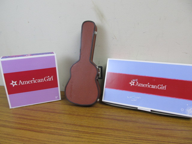 lot 178 image: NIB American Girl Outfits & Guitar