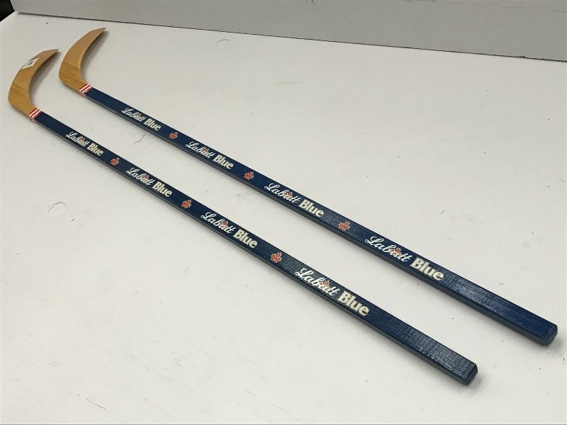 lot 110 image: (2) Labatt Blue Wooden Hockey Stick...