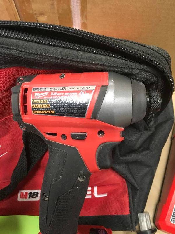 Milwaukee M18 Fuel Hammer DrillDriver and 14 in. Impact Driver Kit used in good working condition