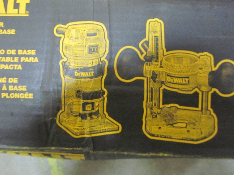 lot 102 image: DEWALT 1.25 HP Compact Router with Plunge Base and Bag