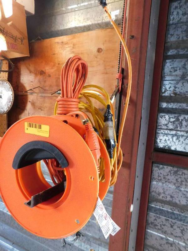 lot 8 image: THREE EXTENSION CORDS AND REEL