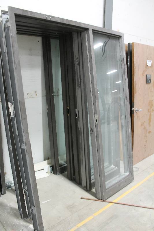 lot 128 image: Single Metal Door Frames w Full Length Glass Side Panels