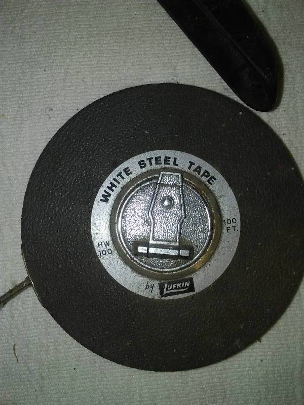 lot 19 image: Lufkin 100 ft. steel tape measure, clamps, plier, pipe cutter, drywall corner tool and more