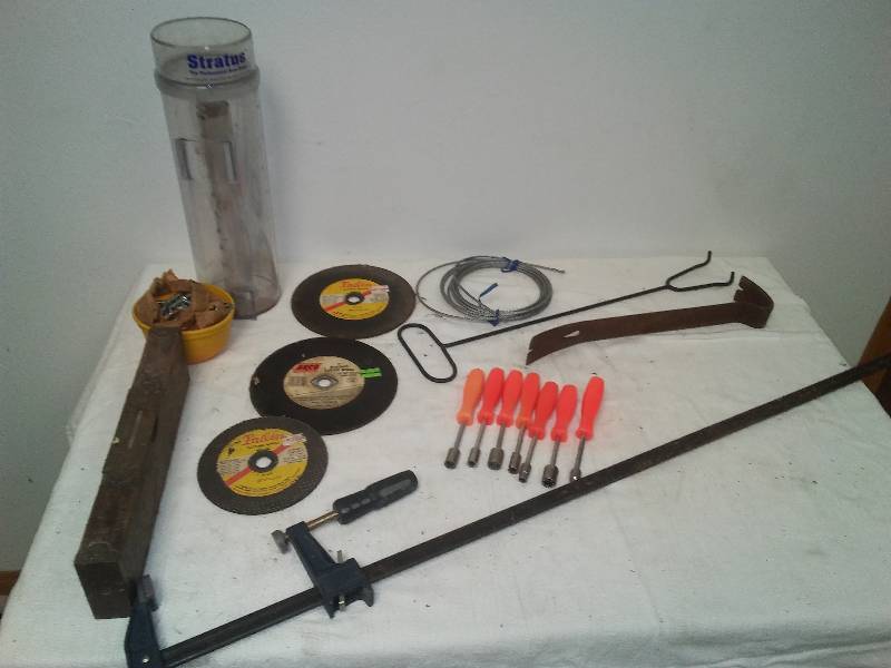 lot 22 image: Rain Gauge, antique bubble level, 7 cut off wheels, 7 nut drivers and more