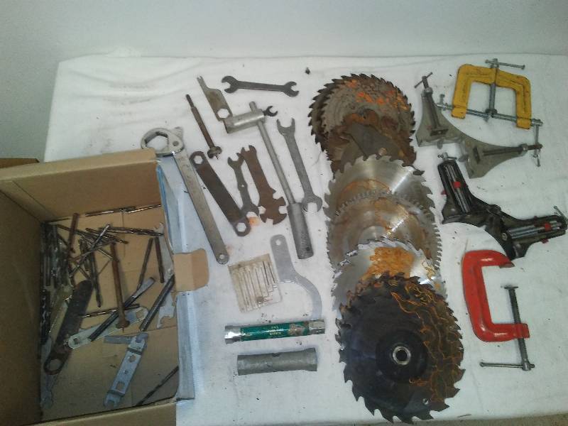 lot 73 image: Tools, wood working clamps, 17 saw blades, multi wrench and more