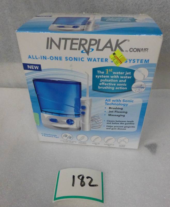 new Interplak waterjet tooth brushi...