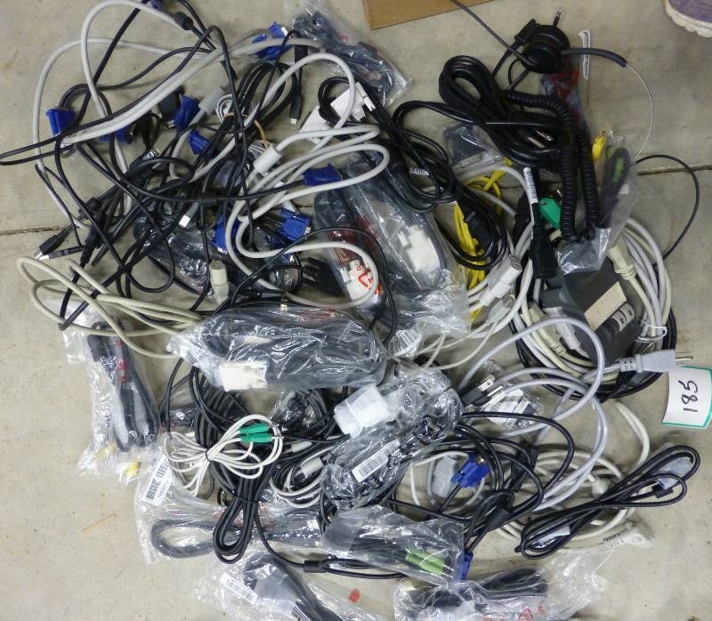 lot of computer cables, power cords...