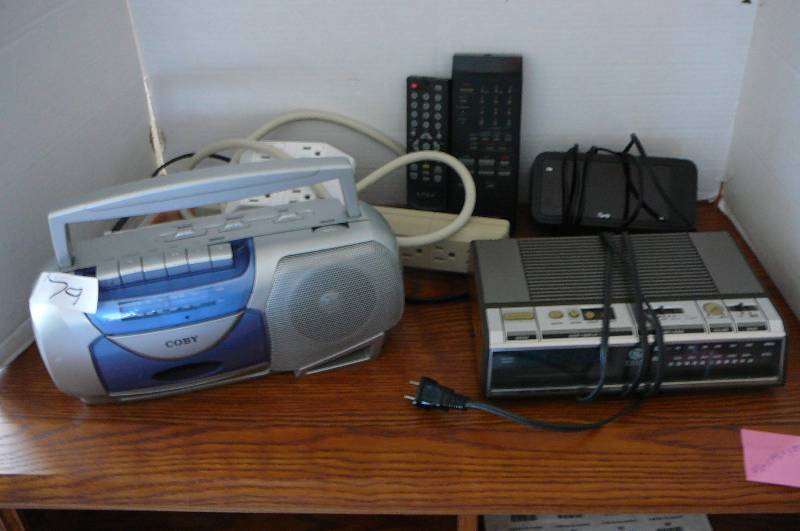 lot 79 image: Portable RadioCassette Player, 2 Clock Radios, Plug-In Adapter, Power Strip