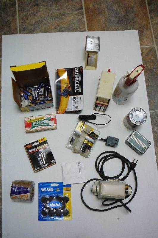 lot 112 image: Misc. Batteries, Felt Furniture Pads, Vintage Sears Swedish Massager, Old Postage Scale, Joke CanCream Of Spotted Owl Soup