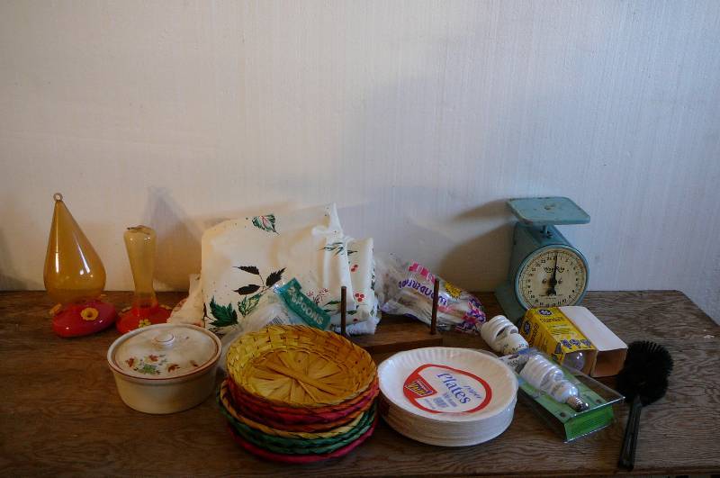 lot 409 image: Paper Plate Holders, Light bulbs, Scale, Humming Bird Feeders, Table Clothes
