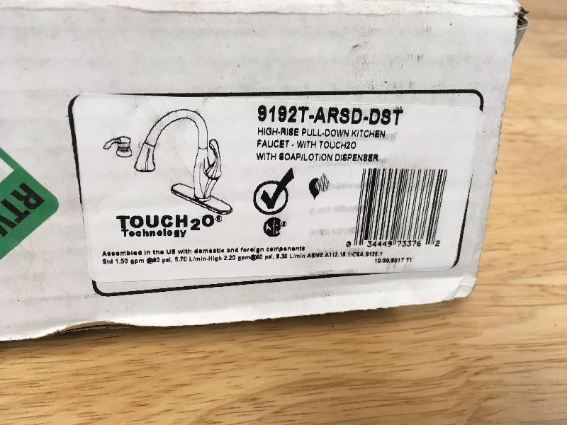 Delta Addison Single-Handle Pull-Down Sprayer Kitchen Faucet with Soap Dispenser and MagnaTite Docking in Arctic Stainless in like new condition