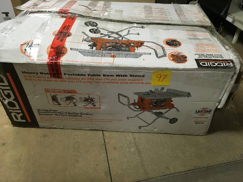RIDGID 15 Amp 10 in. Heavy-Duty Portable Table Saw with Stand Model#  R4513 in good working conditions