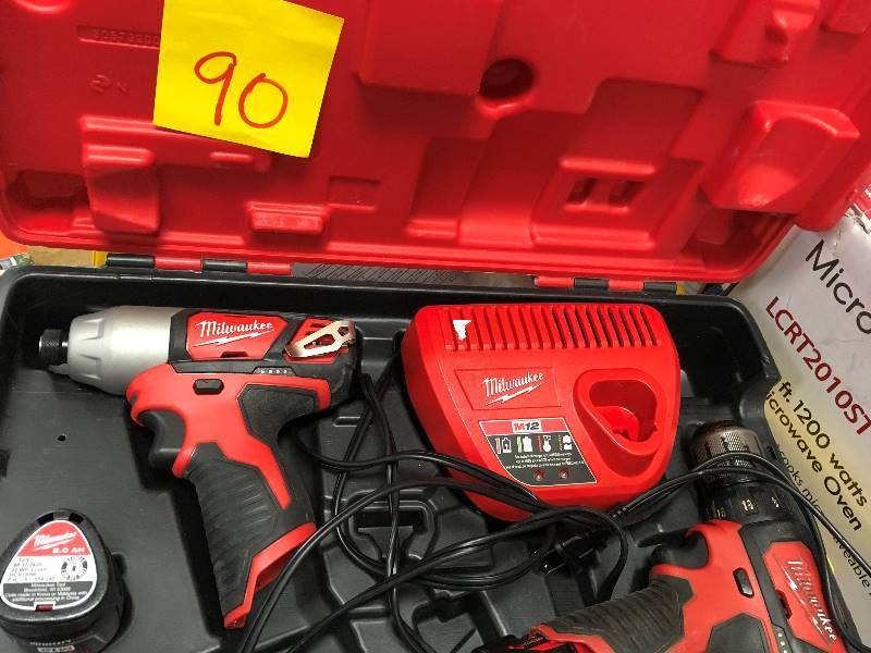 Milwaukee M12 Drill Driver and Impact Drill set includes 2 batteries, charger and hard case used in good working condition