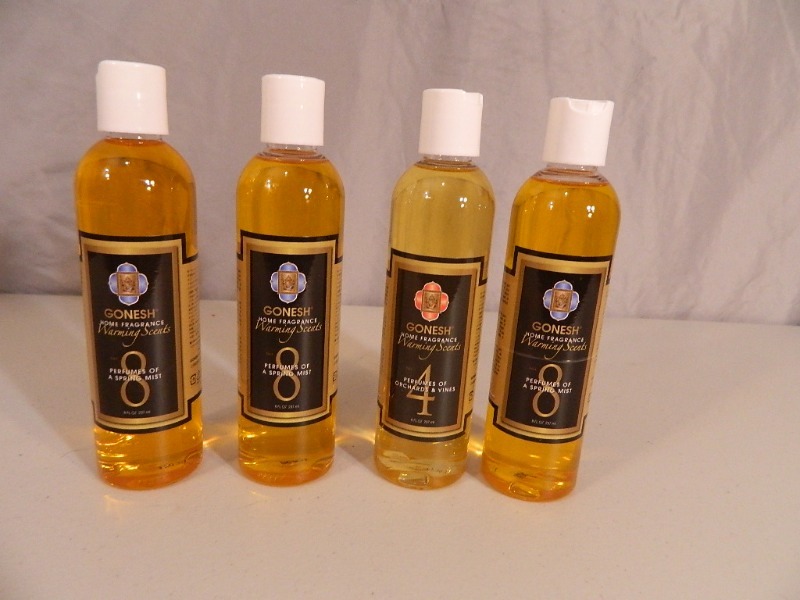 lot 203 image: 4 New Bottles of Warming Scents