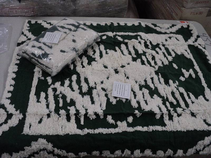 2 green and cream colored pillow sh...