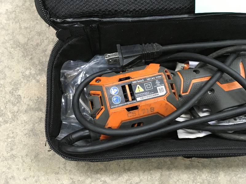 lot 106 image: Ridgid Jobmax 4 Amp Multi-Tool with Tool Free Head In working conditions
