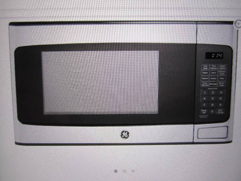 lot 2 image: GE 1.1 Cu Ft Countertop Microwave i...