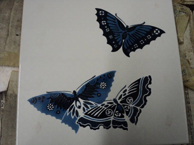 lot 42 image: butterfly patterned tile from Italy...