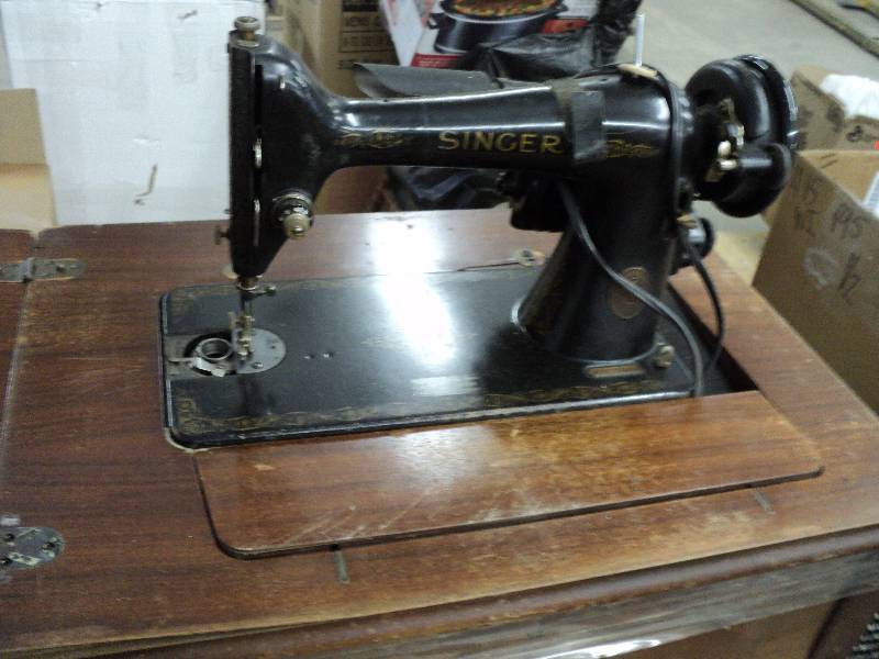 lot 125 image: Vintage sewing machine in cabinet...