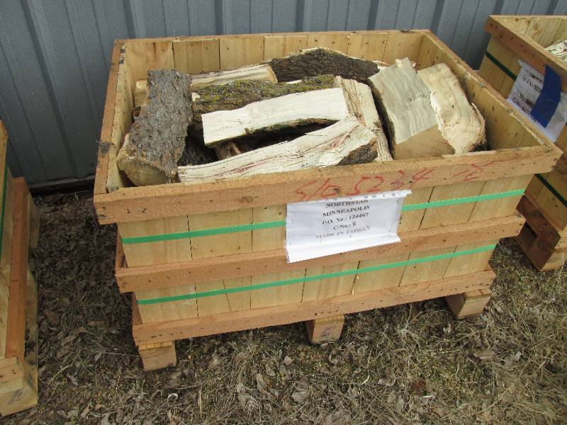 lot 17 image: Wood pallet bin full of firewood, b...