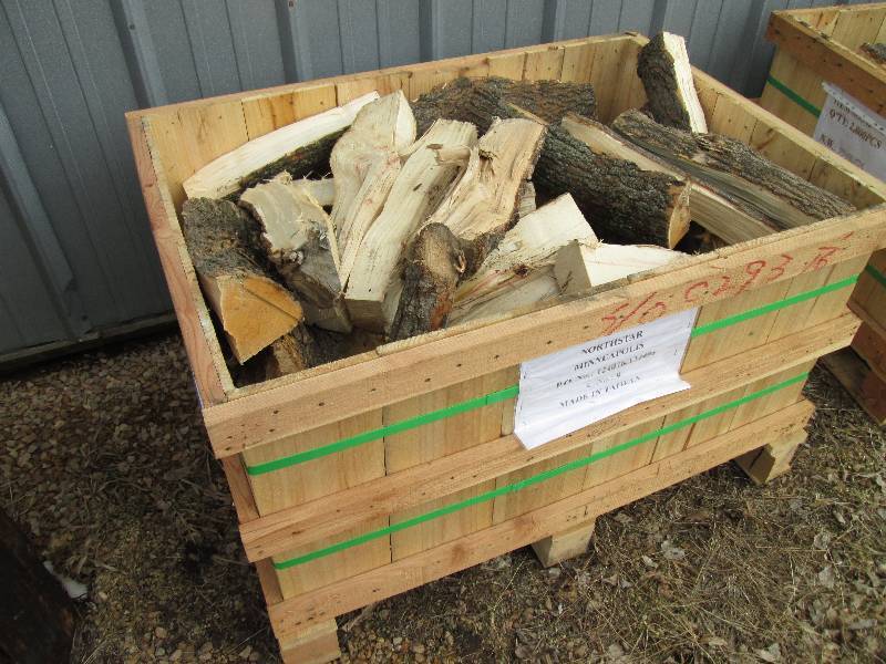 lot 18 image: Wood pallet bin full of firewood, b...