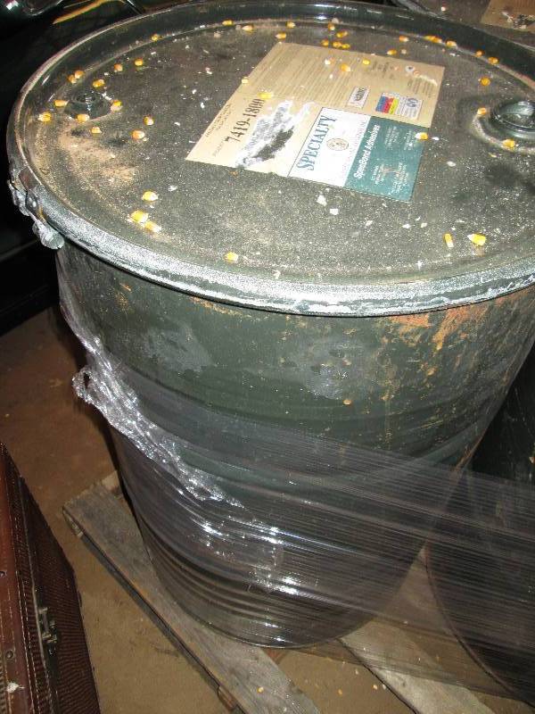 lot 39 image: Metal drum filled with dried corn a...