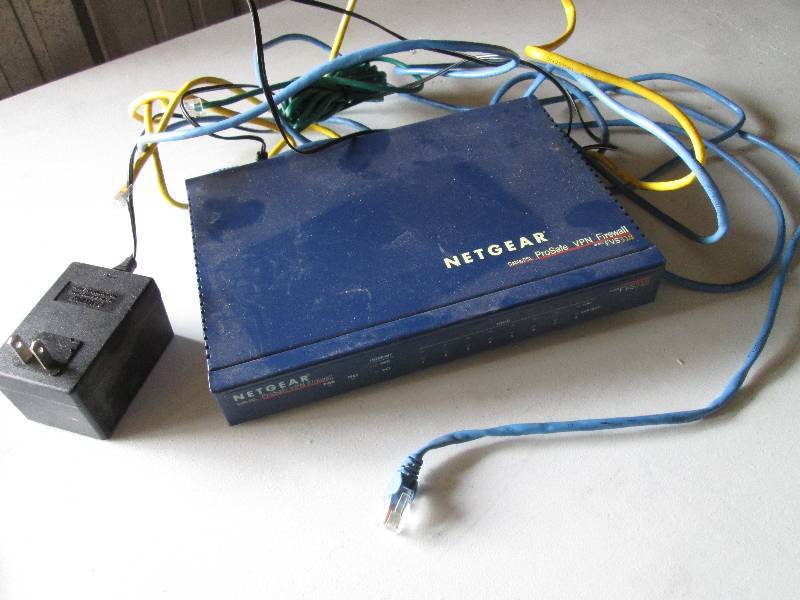 lot 58 image: Netgear cable  DSL firewall FVS318...