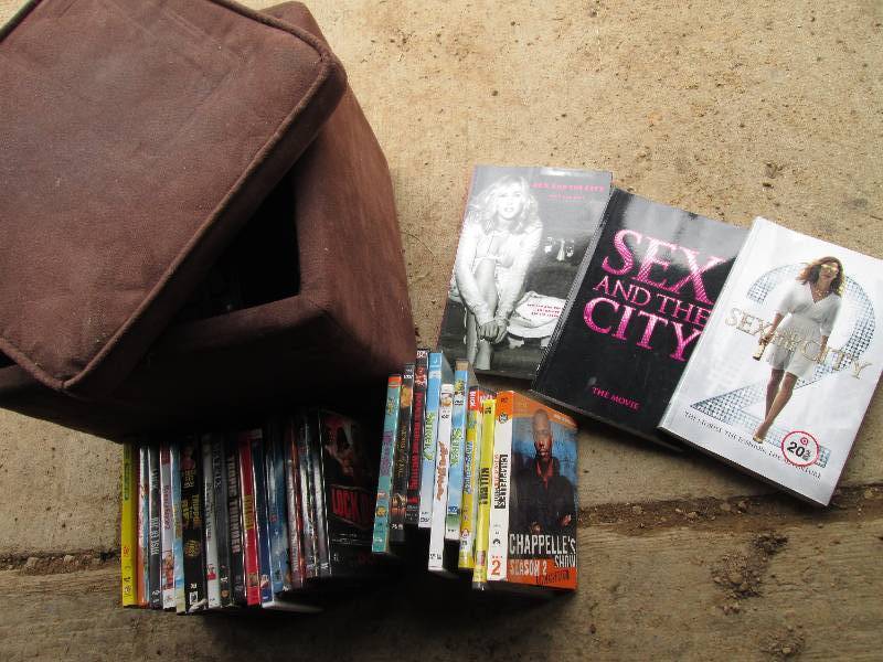 lot 66 image: Footstool filled with movies and Se...