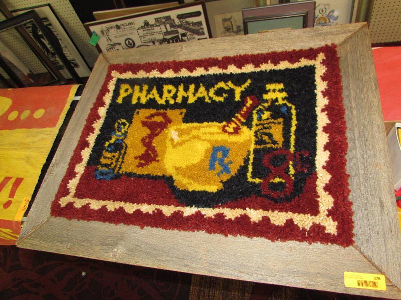 lot 378 image: LATCH WORK PHARMACY WALL HANGING, WITH RUSTIC FRAME.