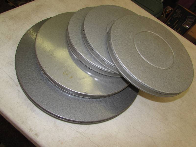 lot 387 image: 5 MOVIE REELS AND TINS